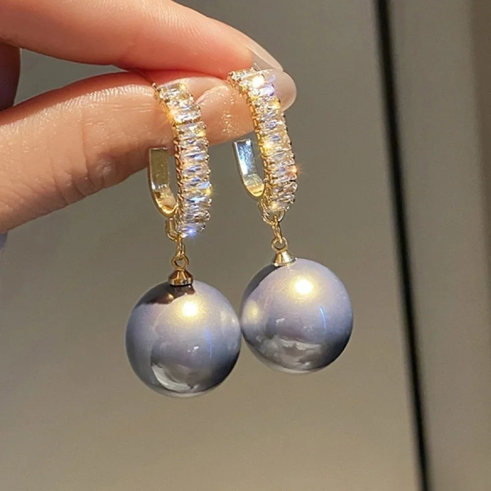 Boucles d'oreilles élégantes avec accents en perles