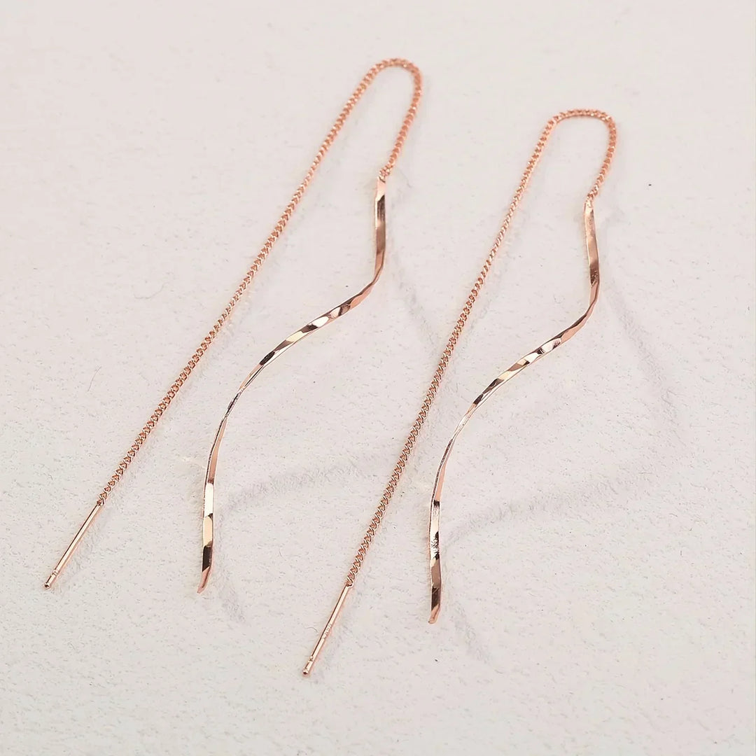 Boucles d'oreilles longues avec design ondulé