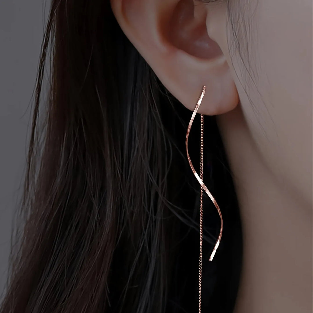 Boucles d'oreilles longues avec design ondulé